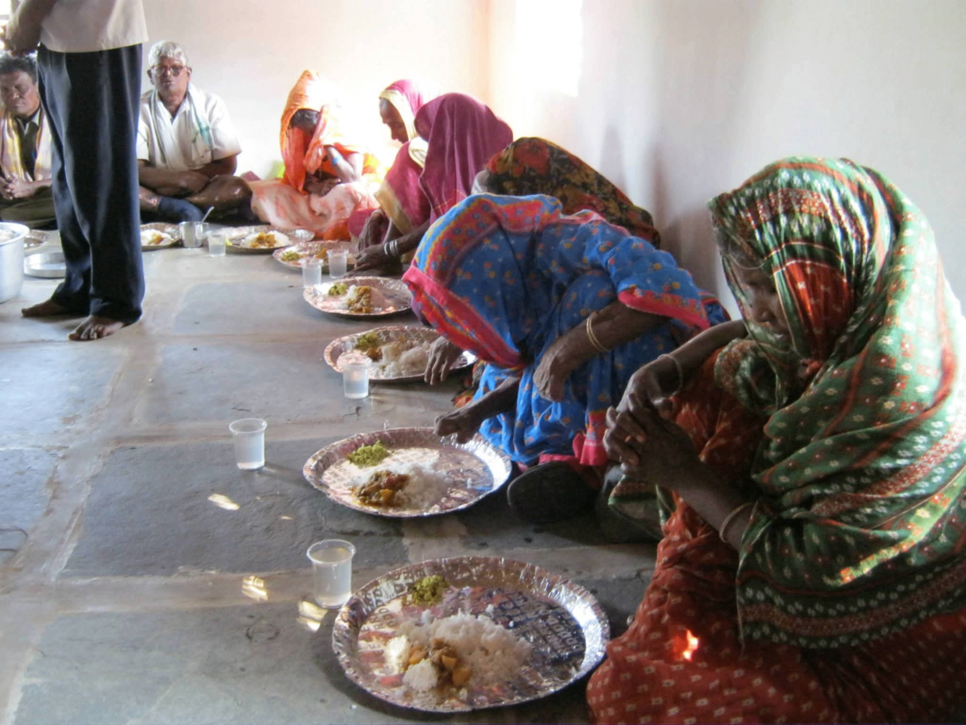 Widows sharing a meal at the church