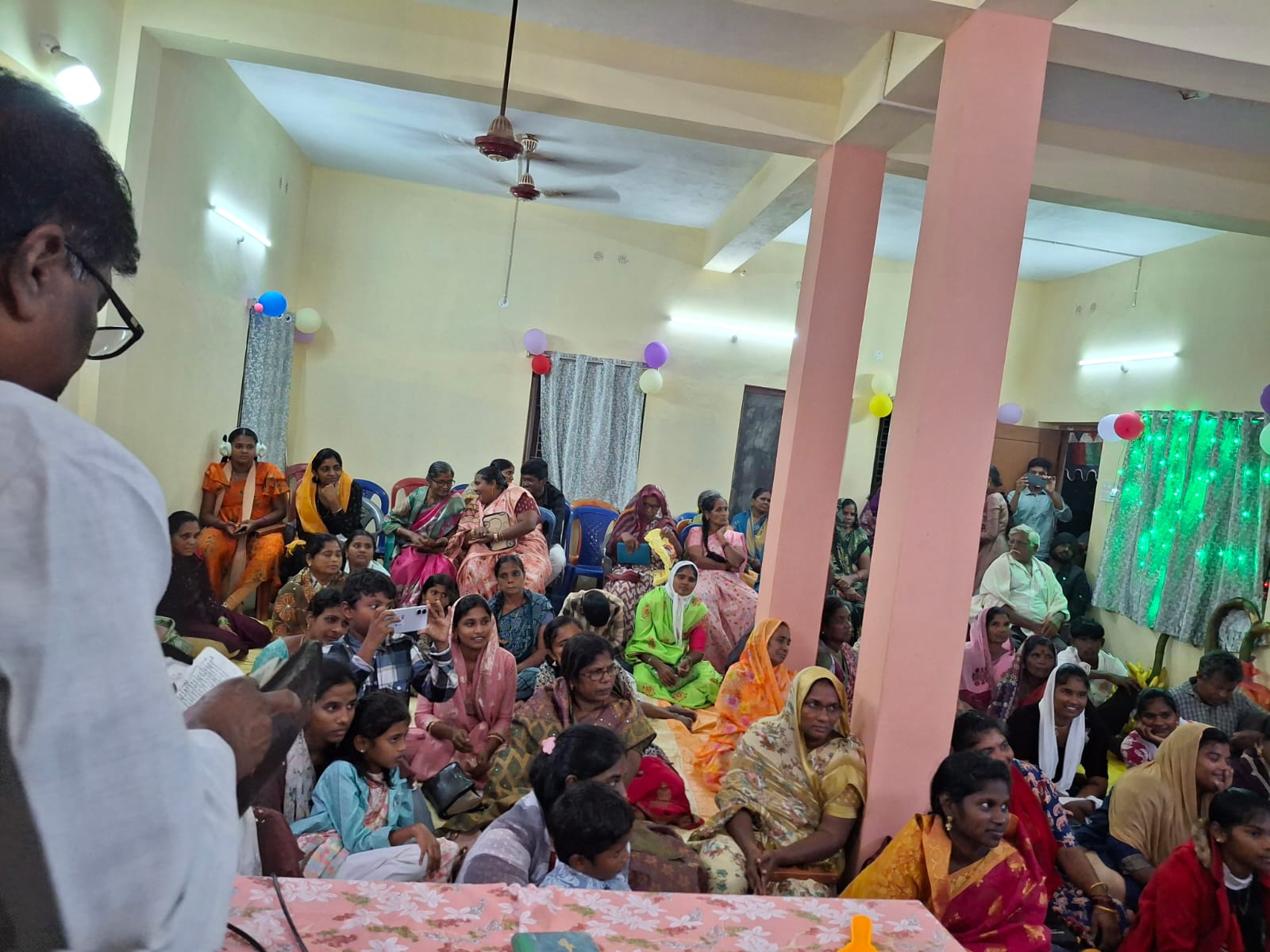 Preaching to a packed hall — Evangelism Ministry