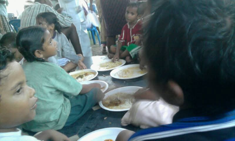 Children sharing a meal — Food for the Needy