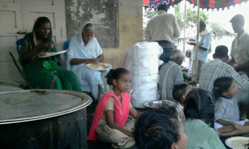 Elders and children fed together — Food for the Needy