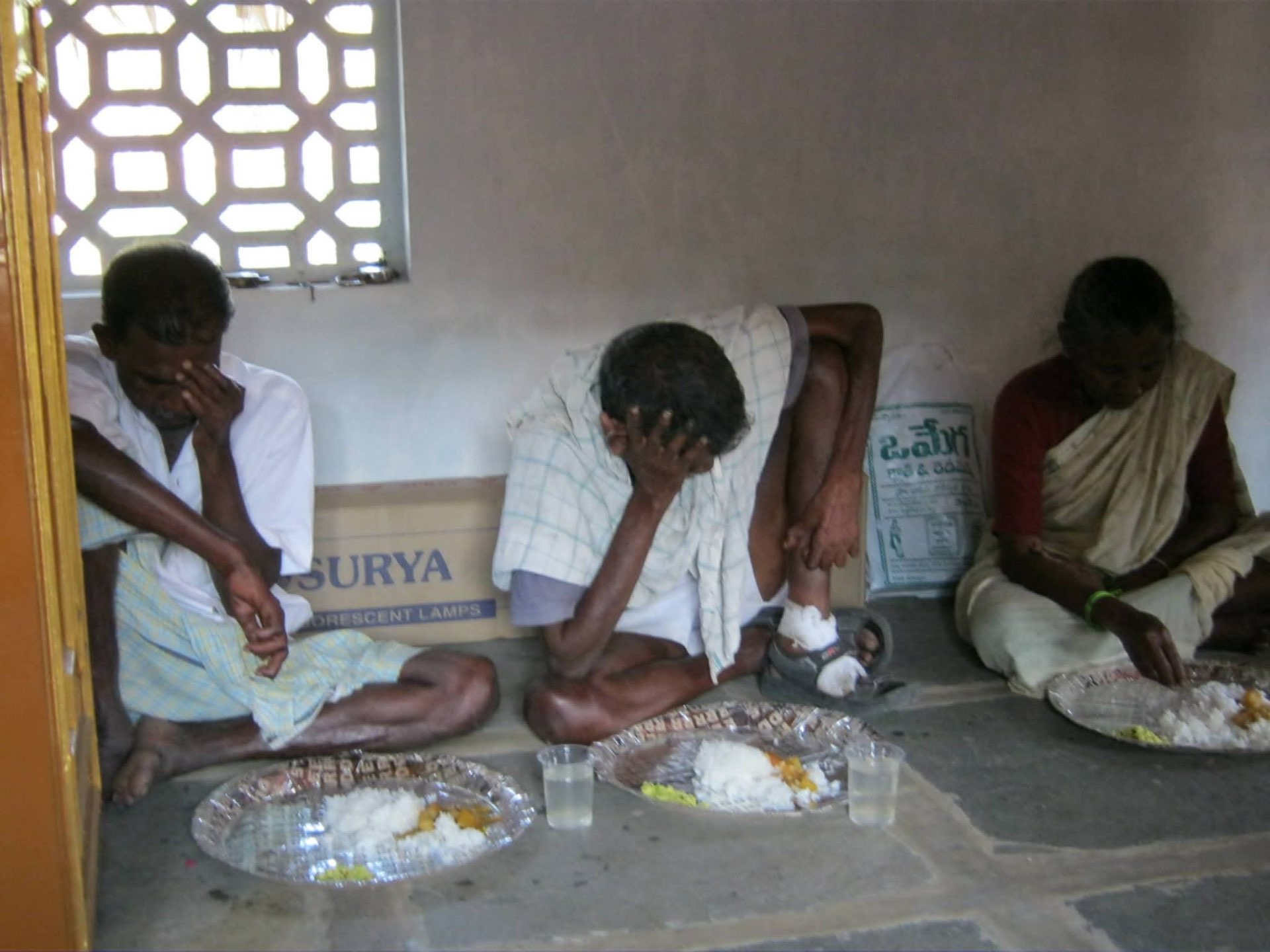 Bowing in thanks before the meal — Ministry to Lepers