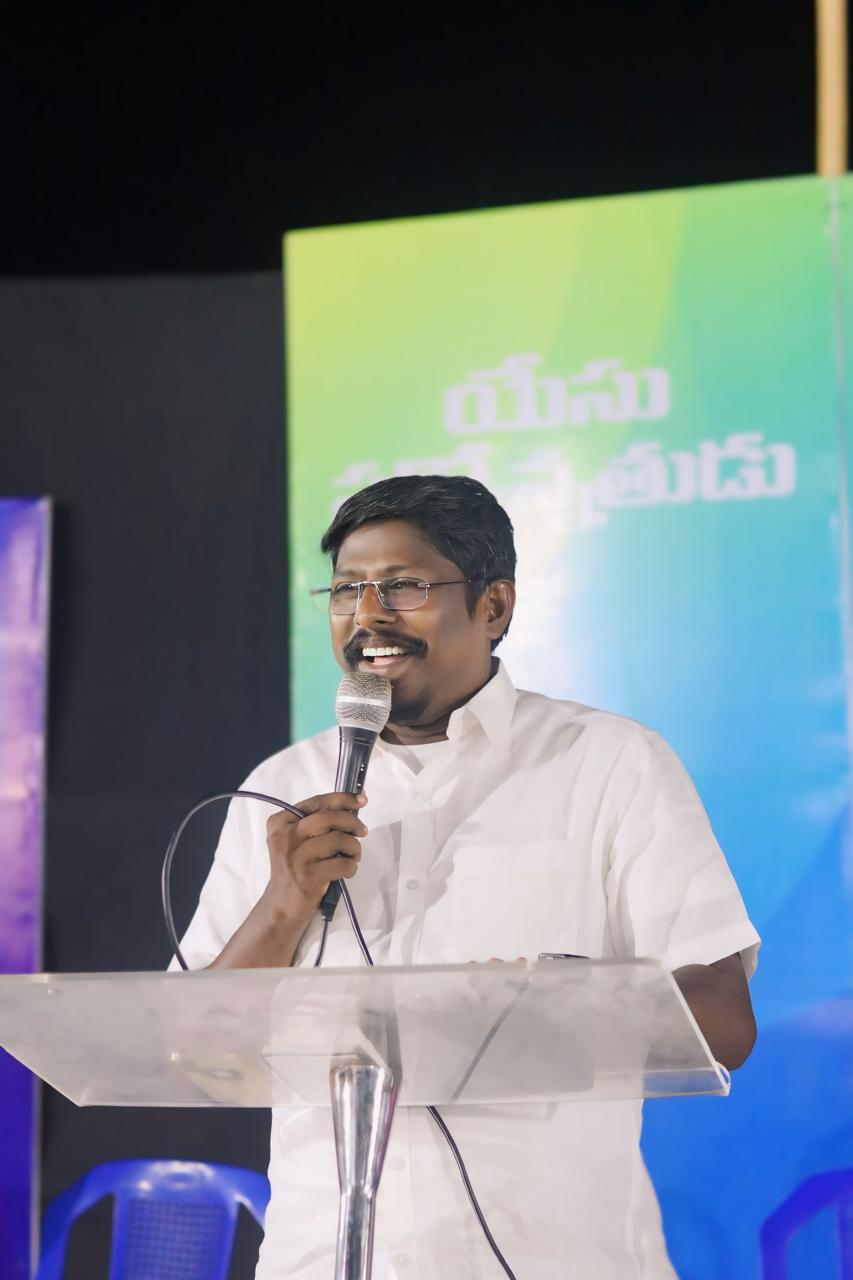 Pastor Peter preaching the Gospel at a Beracah Gospel Ministries gathering