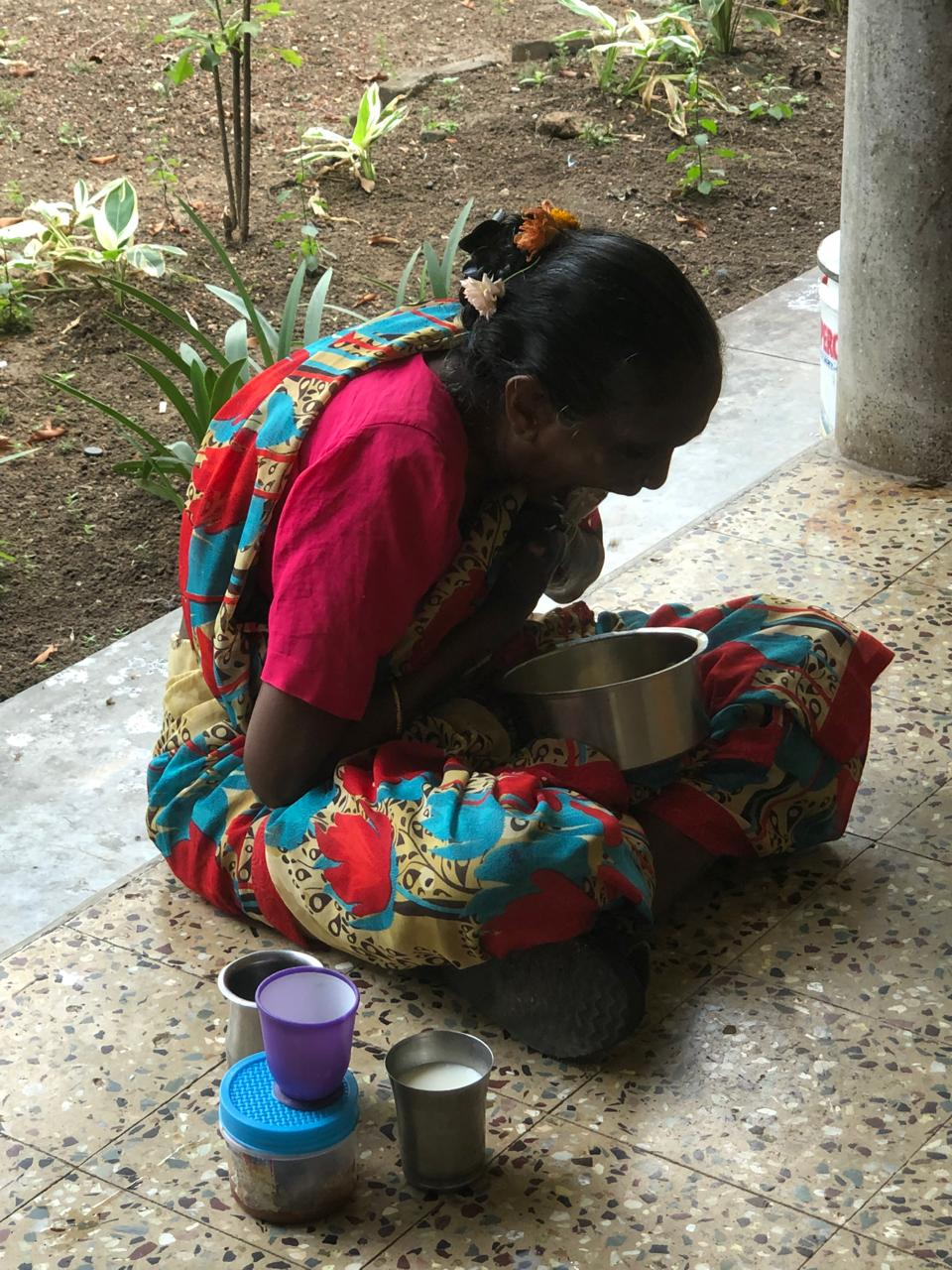 A widow receiving care and support with a meal beside her